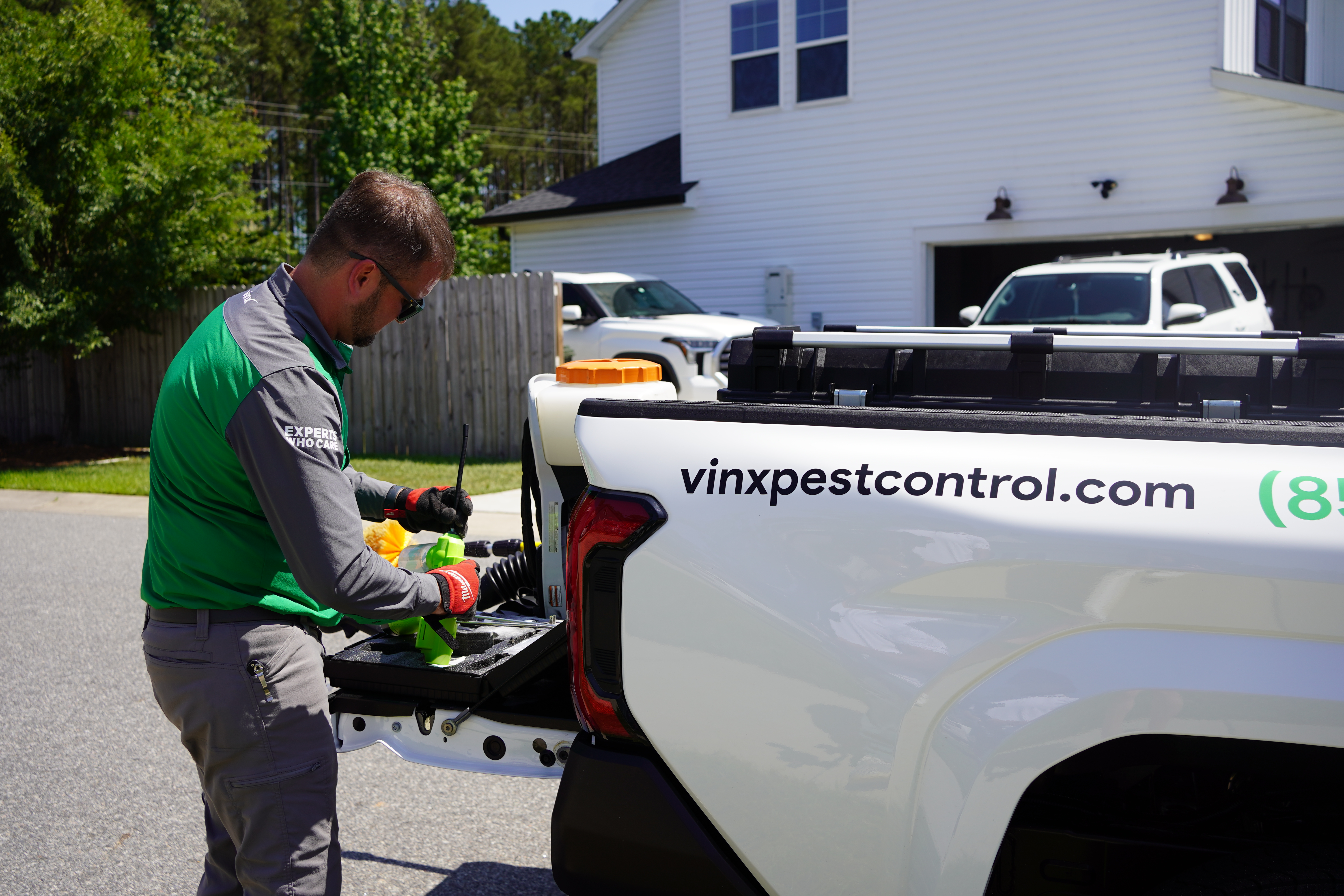 Vinx mosquito control technician preparing equipment Columbia SC