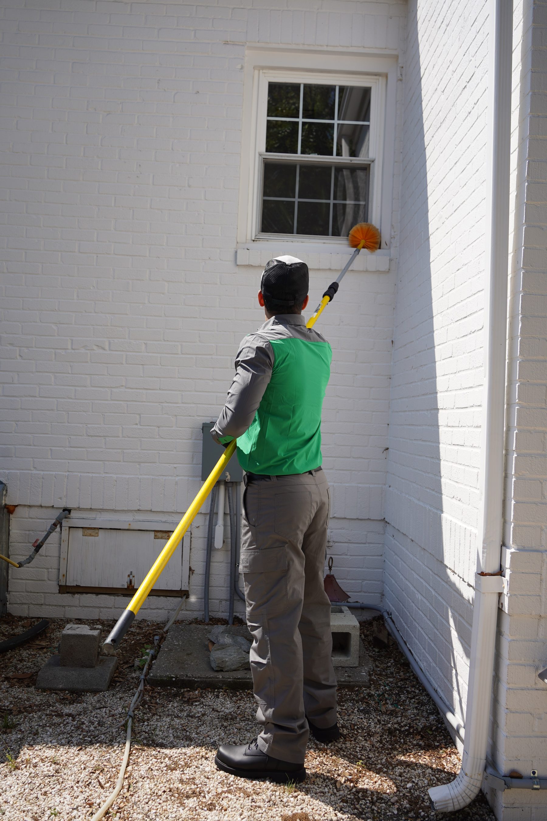 Vinx technician performing exterior treatment in Raleigh NC